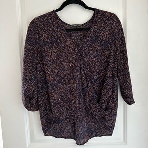 Dark blue with orange spotted blouse
